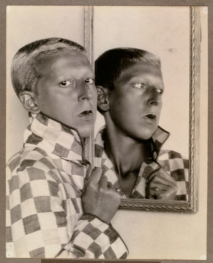 Claude Cahun self-portrait with reflected image in mirror